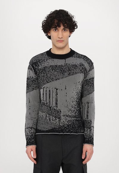 Black and gray patterned knit sweater with a round neck, featuring a textured design of vertical and horizontal lines. Long sleeves, ribbed cuffs.