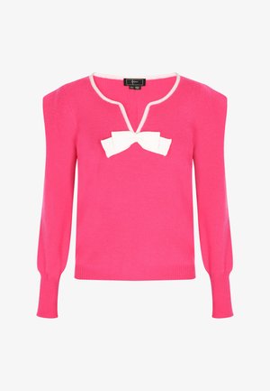 Fuchsia trui met een V-hals, witte strikdetail op de borst en lange mouwen met ribbelmanchetten. Gemaakt van zachte gebreide stof.