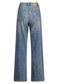Wide-leg blue denim jeans with a faded finish, featuring a tan leather patch, two back pockets, and contrasting stitching details.