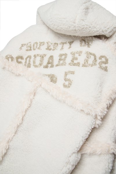 White fleece garment with a soft texture, featuring a hood and the text "PROPERTY OF DSQUARED2" in gold on the front.