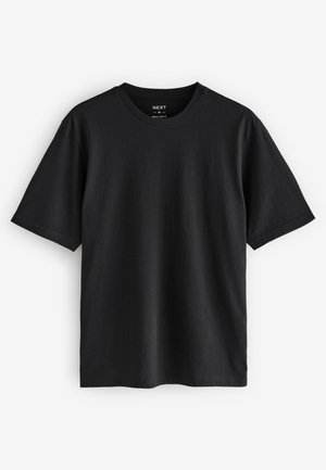 T-shirt noir à col rond, manches courtes, coupe régulière, fabriqué en tissu lisse et léger, avec des coutures minimales et sans motifs.