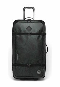 Valise à roulettes de couleur vert foncé avec une surface texturée. Équipée de sangles noires, d'un logo en forme de diamant et d'une poignée sur le côté. Dimensions sur le côté.