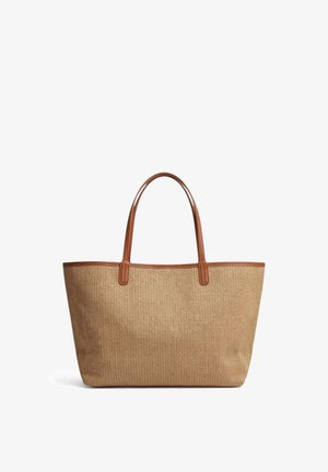 Beige woven tote bag with brown leather handles and trim, rectangular shape, and spacious interior, shown on white background.