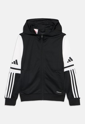 Sweat à capuche noir zippé avec manches rayées blanches et noires, une capuche et un petit texte "AEROREADY" près de l'ourlet inférieur à l'avant.