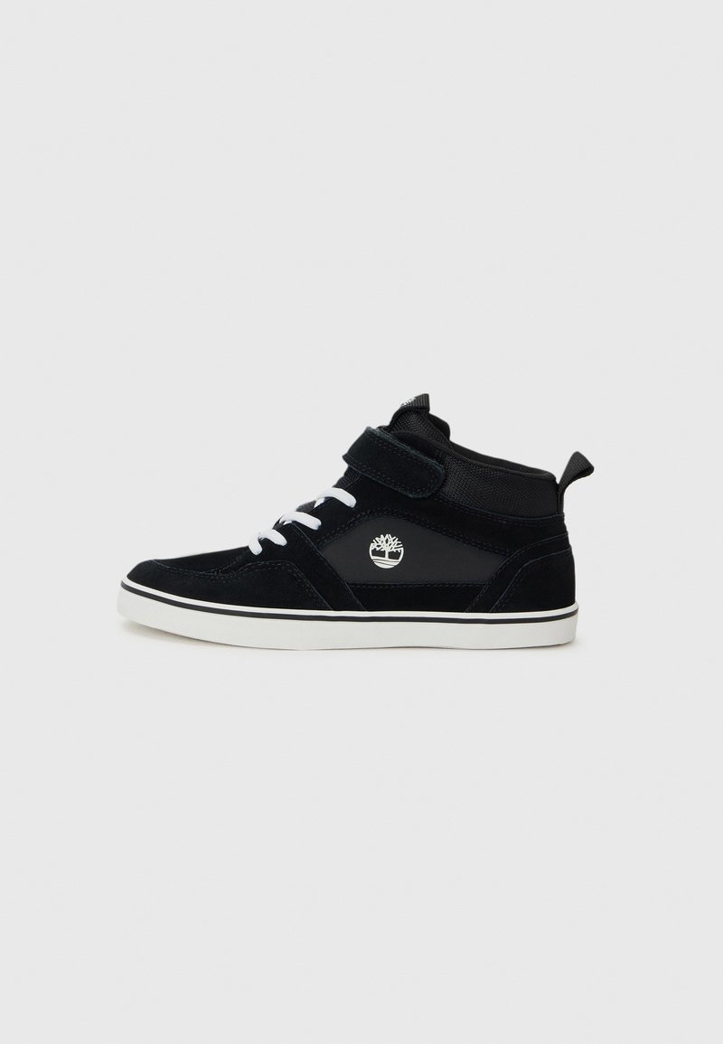 Black high-top sneakers featuring a combination of suede and synthetic materials, white laces, a Velcro strap, and logo detail on the side.