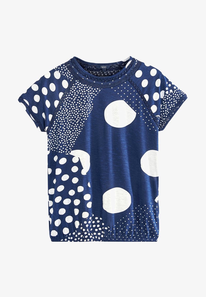 Camisa de manga corta azul marino con patrones de lunares blancos mezclados y dobladillo elástico.