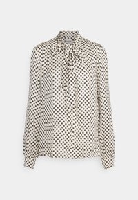 Cremefarvet bluse med sort cirkulært geometrisk mønster, lange ærmer med knapmanchetter og en bundet sløjfe ved kraven.