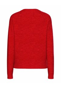 Raudonas megztinis su ilgomis rankovėmis ir apvaliu iškirpimu. Minkšta tekstūra, šiek tiek trumpesnis apatinis kraštas ir gumuoti rankogaliai. Paprastas dizainas, be raštų ar akcentų.