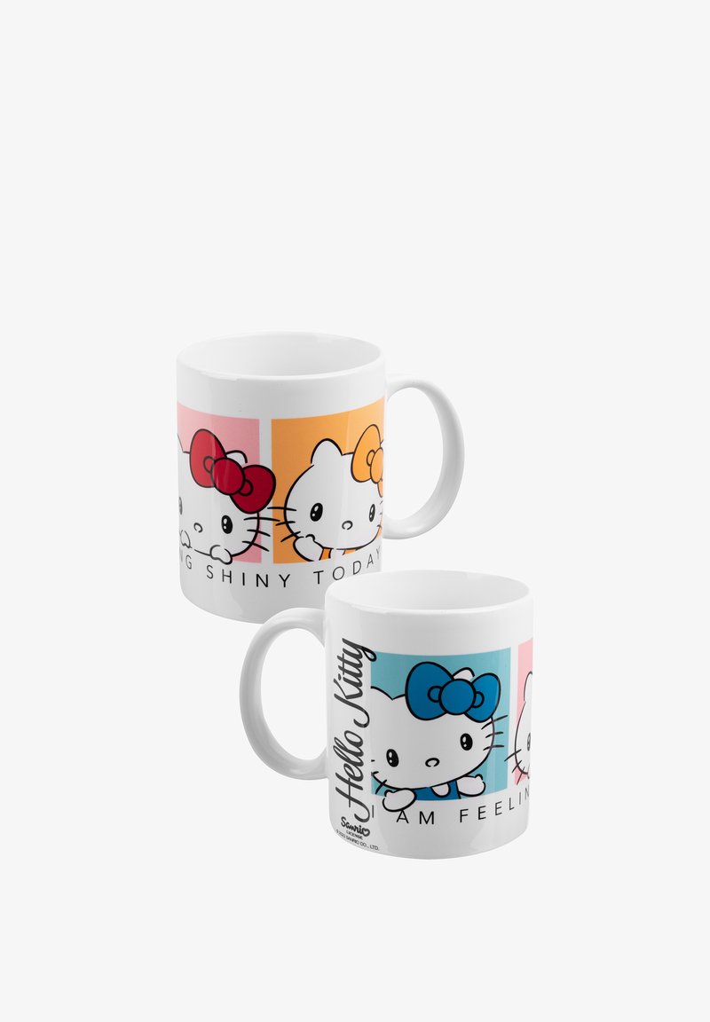 White ceramic mugs featuring Hello Kitty faces with pink, orange, and blue bows and text on colorful square backgrounds.