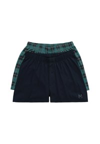 Kaksi miesten bokseriparia: yksi tummansininen, jossa on logo, ja toinen vihreässä ruutukuosissa. Molemmissa on joustavat vyöt ja rento istuvuus.