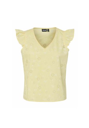 Blusa amarilla sin mangas con escote en V, mangas con volante y patrón floral calado por todo el diseño.