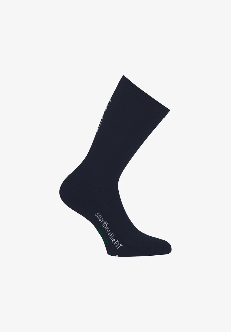 Mørkeblå, ribbet crew-sok med en tætsiddende design. Inkluderer hvid brandingtekst og en grøn accent på sålen. Blødt materiale.