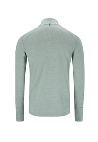 Lange mouwen poloshirt in lichtgroen, gemaakt van een zachte, gestructureerde stof. Bevat een kraag en subtiele stikseldetails op de mouwen.