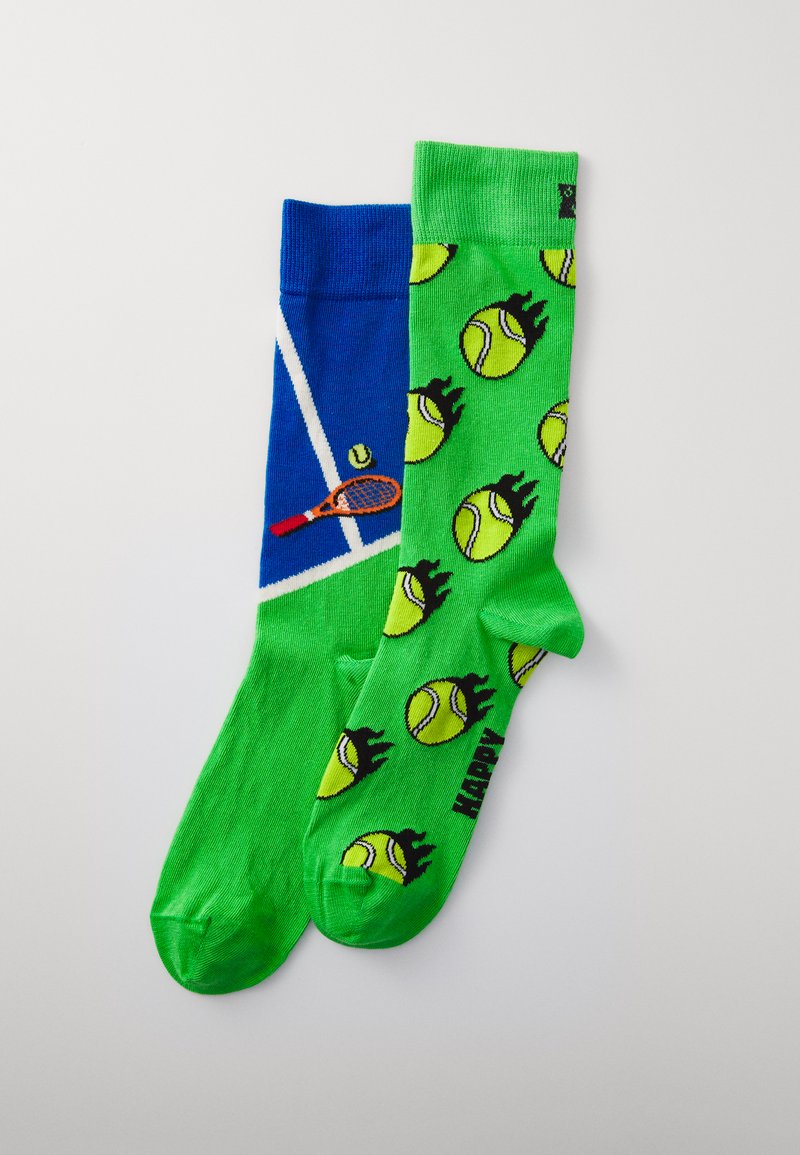 Strumpor med en blå och vit design på ena sidan som föreställer ett tennisracket och en boll, och ljusgrön färg med gula tennisbollar på den andra sidan.