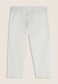 Leggings bianchi a vita elastica, lunghi fino ai piedi, stesi su uno sfondo neutro, che mostrano il lato posteriore.