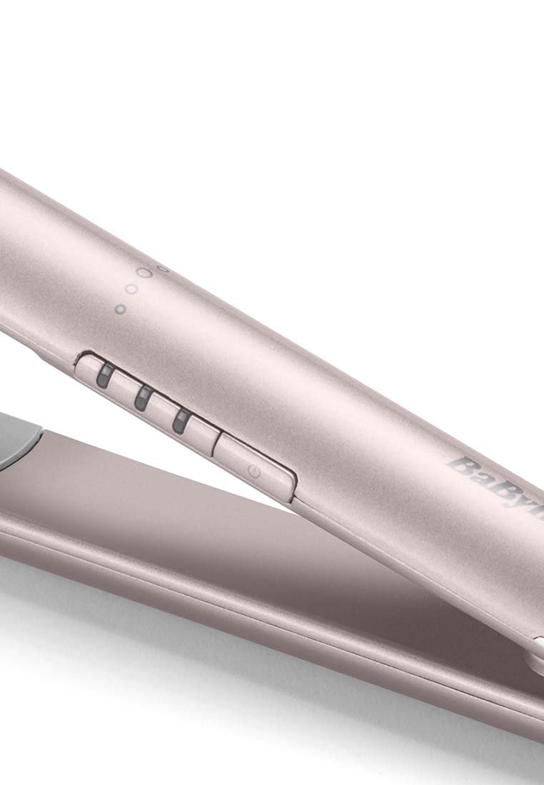 Eleganter Haarglätter in Roségold mit metallischer Oberfläche, ausgestattet mit drei Tasten und Anzeigeleuchten am Griff zur Einstellung der Temperatur.