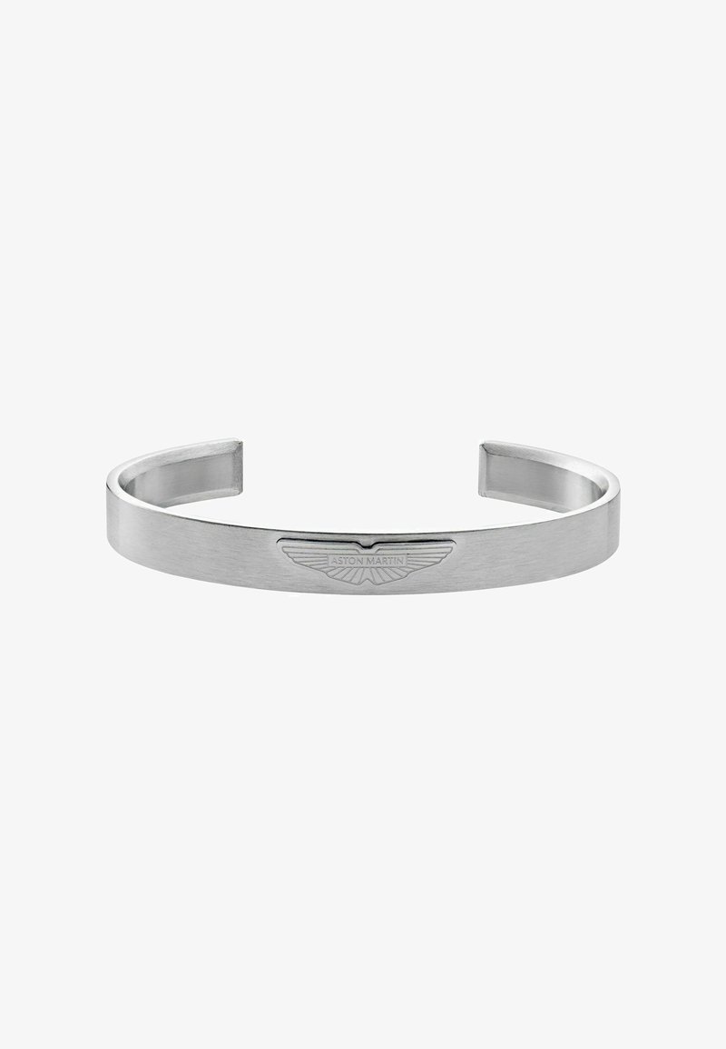 Bracelet manchette en acier inoxydable argenté avec finition brossée, présentant un logo Aston Martin gravé. Design ouvert, élégant et minimaliste.