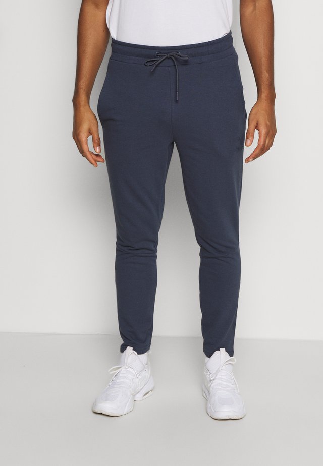 ISAM TAPERED PANTS - Tracksuit bottoms - blue nights