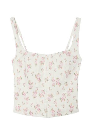 Débardeur court blanc à fines bretelles, avec un motif de petites fleurs roses et orange.