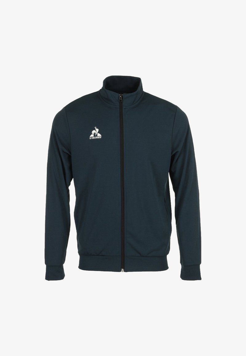 Giacca zip-up blu navy realizzata in tessuto morbido, con colletto alto, maniche lunghe e un logo bianco sul lato sinistro del petto.