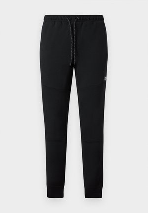 Black sweatpants made of soft fabric, featuring an elastic waistband with drawstring, tapered legs, and side pockets.