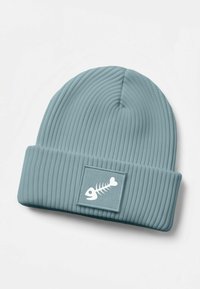 Ribbed beanie in light blue, featuring a fold-over cuff and a rectangular patch with a white lobster skeleton design.
