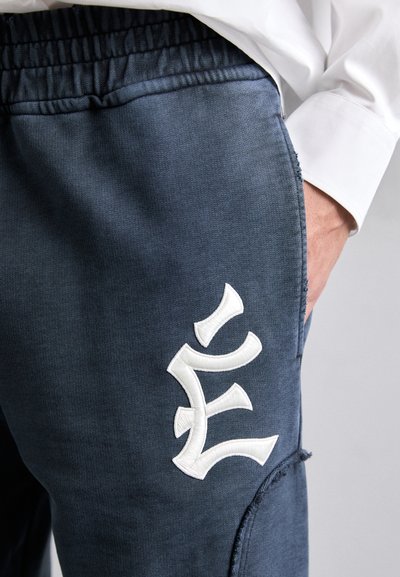 Études PANT EMBROIDERED - Tracksuit bottoms - navy