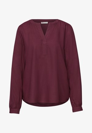 Volná dámská halenka s dlouhým rukávem v tmavě bordó barvě, s výstřihem do V a minimálním šitím, vyrobená z lehké látky.