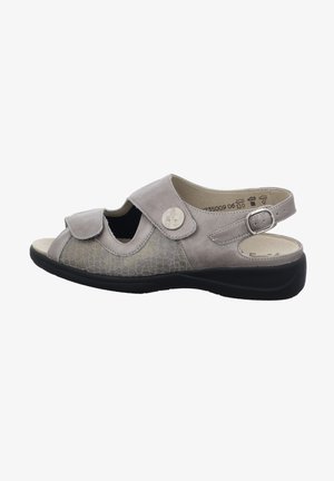 Light gray sandal with a textured leather upper, cut-out designs, a bow accent, and a black rubber sole. Adjustable heel strap for fit.