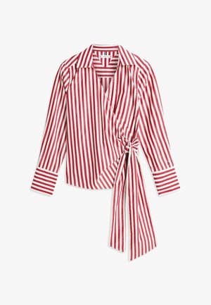 Blouse à manches longues rouge et blanche à rayures verticales avec un col et un détail de nœud sur le côté avant.