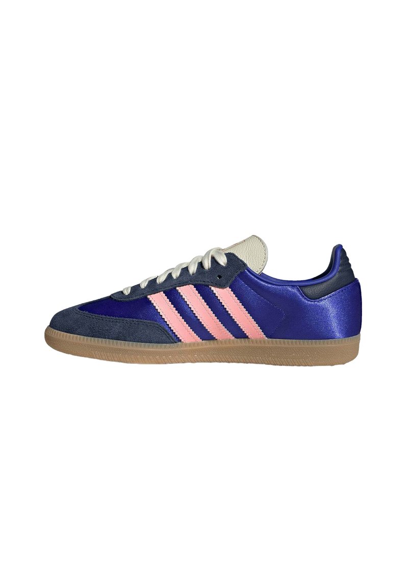 Navy and purple athletic shoe with pink three-stripe design, suede and synthetic materials, round toe, white laces, and gum rubber sole.