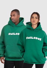 Smilodox LUCIO - UNISEX OVERSIZED - Jersey con capucha - grün