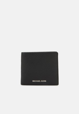 Portefeuille en cuir noir à texture granuleuse, avec un design à rabat et le logo doré "MICHAEL KORS" à l'avant.