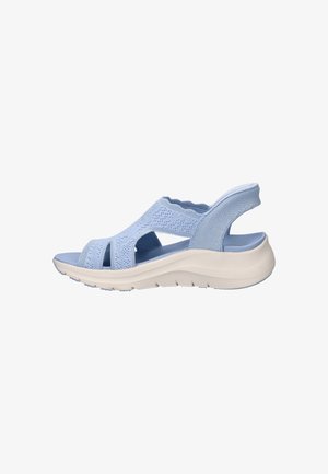 Light blue open-toe sandal with knit upper, cushioned white sole, and elastic back strap for support and comfort.
