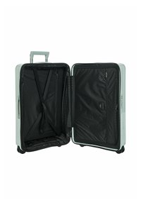 Hartschalentrolley in Hellgrau, ausgestattet mit einem schwarz gefütterten Innenraum, Querschlaufen und einer Reißverschlusstasche. Inklusive Griff und Rollen.