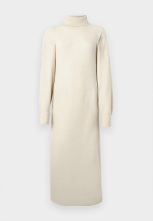 Robe en tricot crème avec un col montant, de longues manches bouffantes et une longueur midi. Présente une texture avec un léger motif en relief.