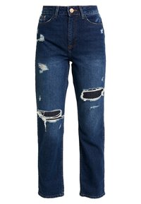 Denimblå högmidjade jeans med slitna detaljer, som har stora hål vid knäna och fransiga kanter för en avslappnad stil.