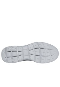Suela de zapatilla de goma en gris con un patrón texturizado, con un diseño de rejilla para tracción y flexibilidad. Logotipo grabado cerca del talón.