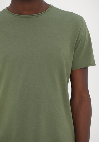 Olive green cotton t-shirt with a round neckline, short sleeves, and a smooth texture. Simple design with no visible patterns or accents.