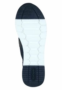 Schwarze Schuhsohle mit einem strukturierten Grip-Muster, das weiße Segmente und ein zentrales Logo aufweist. Das Design betont Langlebigkeit und Traktion.