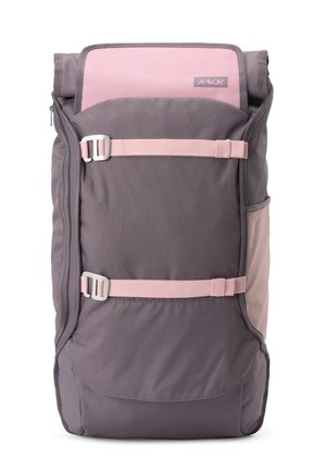 Tall, rectangular gray and pink backpack with two horizontal pink straps and a side mesh pocket, branded with a small tag on the top flap.