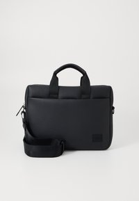 Black textured laptop bag with dual top handles, detachable strap, zip closure, and a small logo patch for branding.