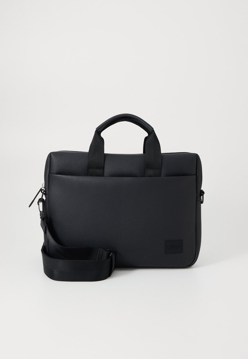 Black textured laptop bag with dual top handles, detachable strap, zip closure, and a small logo patch for branding.