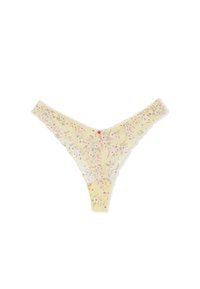 Yellow lace thong with small pink and white floral pattern and scalloped edges, laid flat on white background.