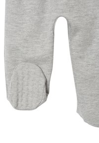Gray cotton pants with reinforced, dotted elbow patches and a soft texture. Features a relaxed fit and curved cut at the knees.