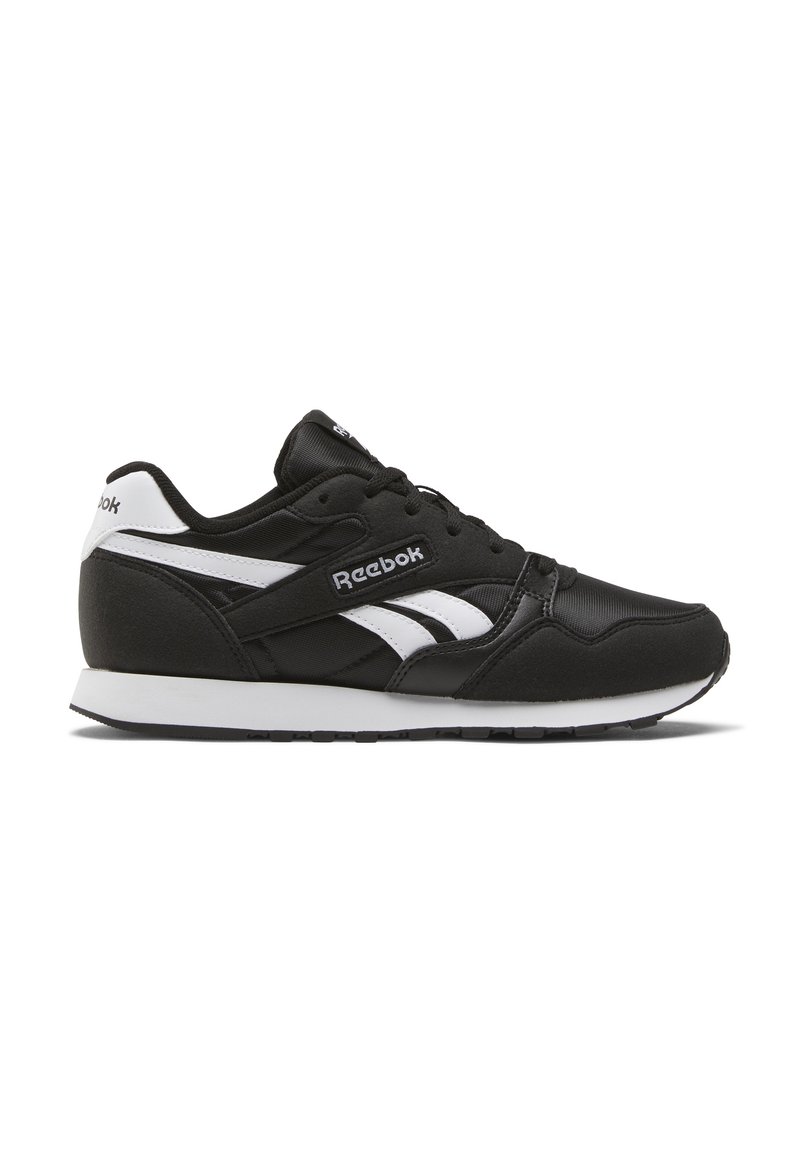 Black athletic sneaker with white accents, featuring a textured upper, lace-up design, cushioned sole, and Reebok branding on the side.