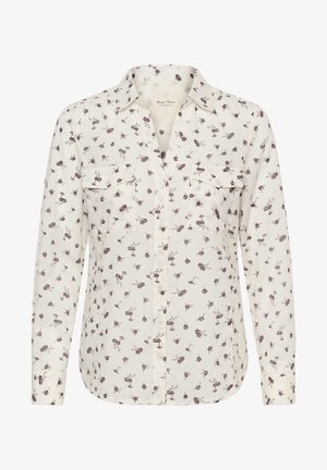 Blouse met lange mouwen in crèmekleurige stof met een bloemmotief in paars en bordeauxrood, voorzien van twee zakken aan de voorkant en een kraag.