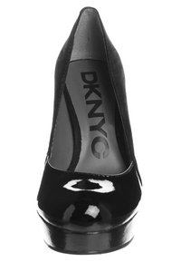 Escarpin noir en cuir verni avec un bout rond, un design élégant et une finition lisse. Doté d'une semelle intérieure rembourrée et d'un logo à l'intérieur.