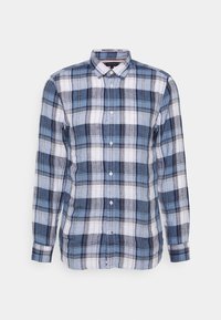 Blå och vit rutiga skjorta med knäppning framtill, långa ärmar och krage. Tillverkad av ett lätt tyg med en mjuk yta.