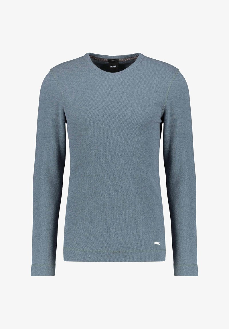 Pull homme à manches longues et col rond en tissu tricoté bleu discret avec un petit détail de logo près de l'ourlet.